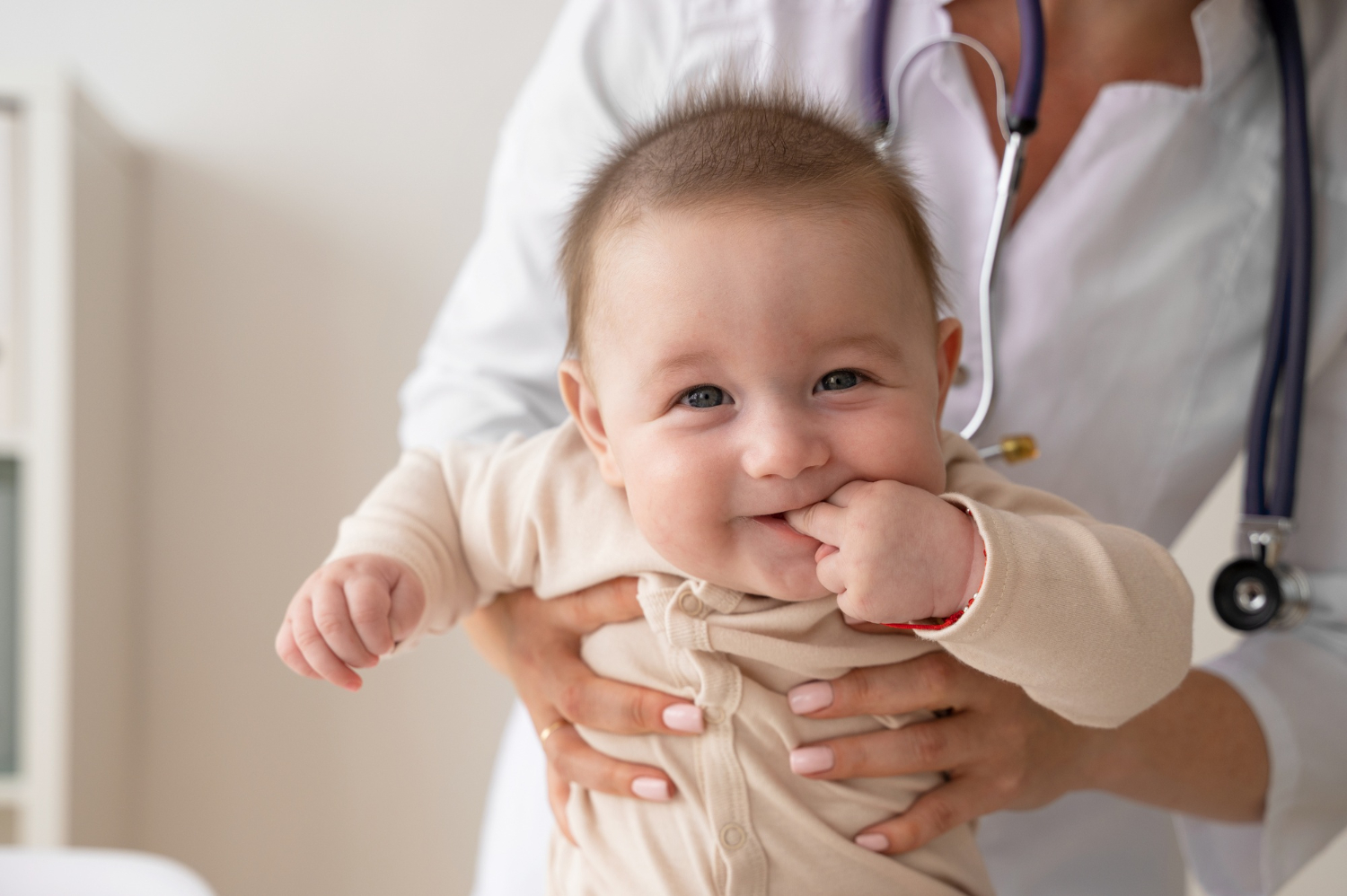 front-view-doctor-holding-baby